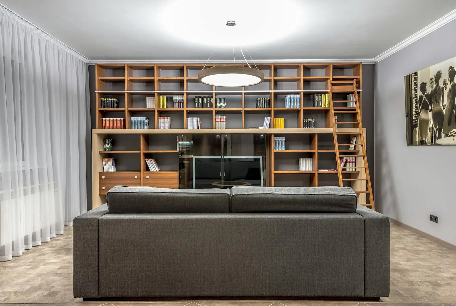 Bespoke floor-to-ceiling fitted shelving with a sliding ladder