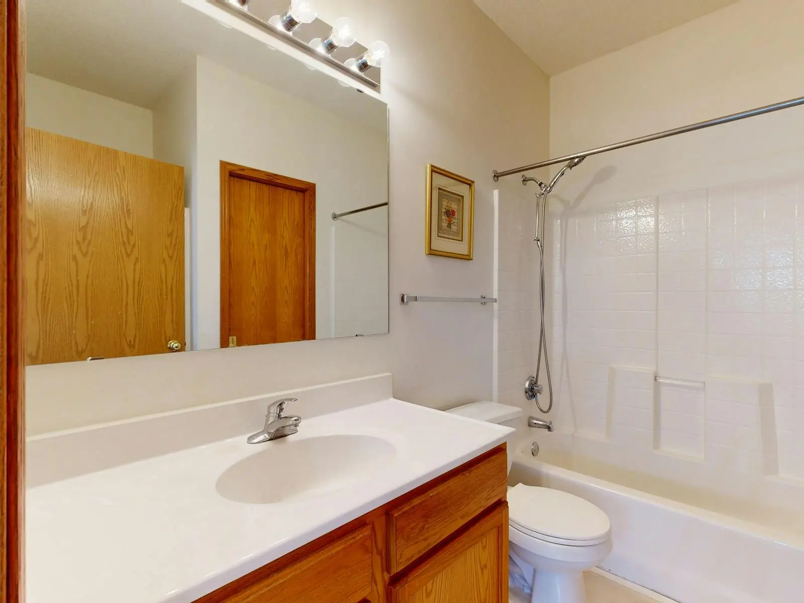 Refitted family bathroom with a bath and shower over