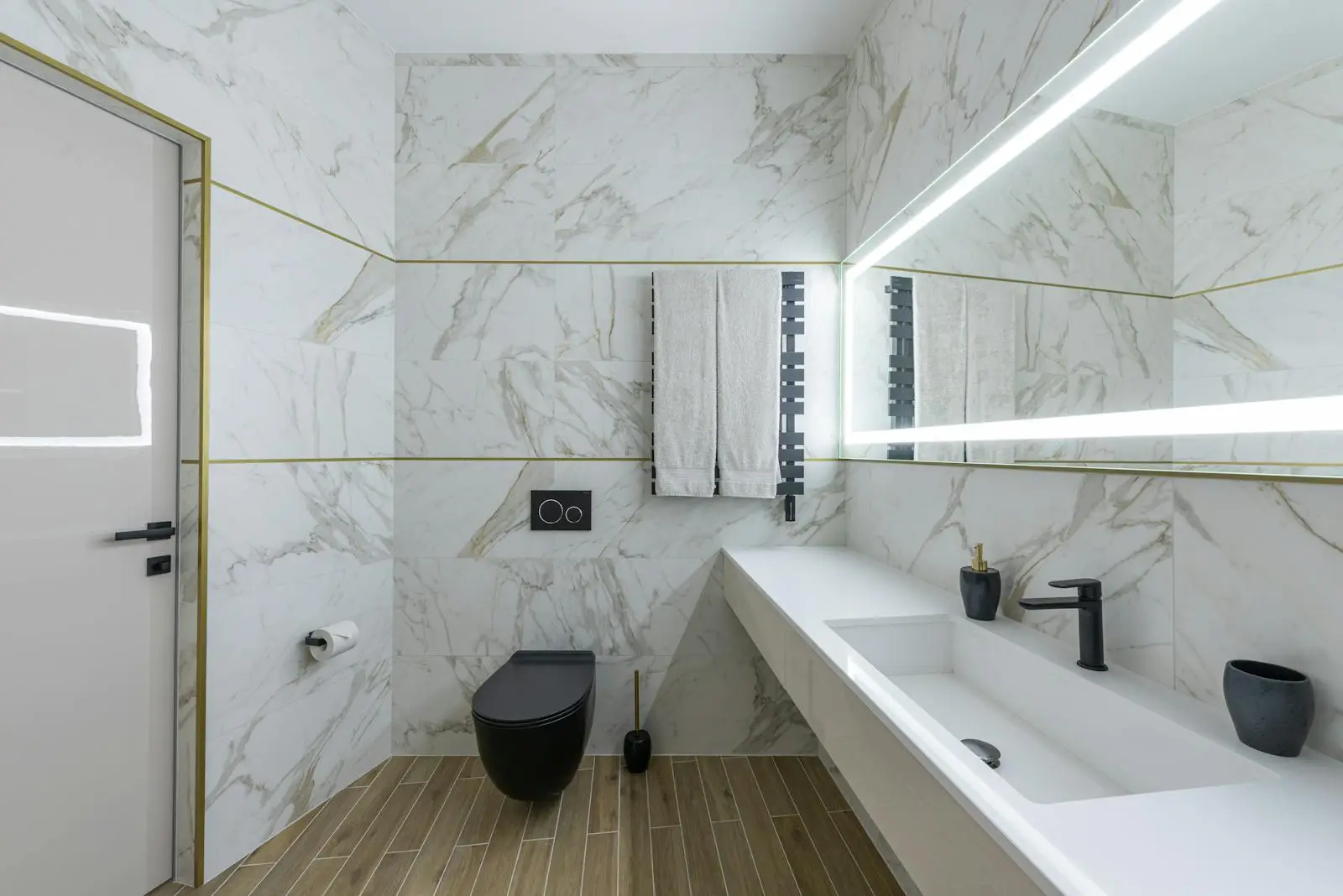 Marble-tiled wet room with a walk-in shower